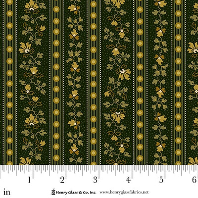 Fabric with gold floral stripes on a green background, featuring a ruler for scale.