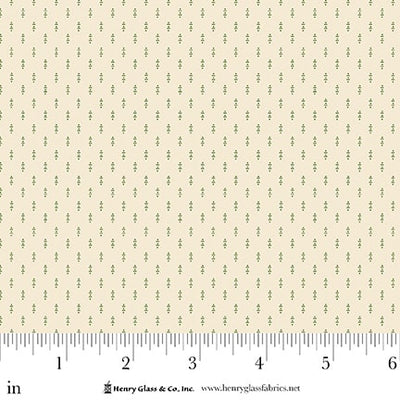 Fabric with a subtle green [attern on a cream background, featuring a ruler at the bottom for scale.