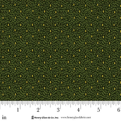 Green fabric with yellow and green all over pattern and ruler for scale.